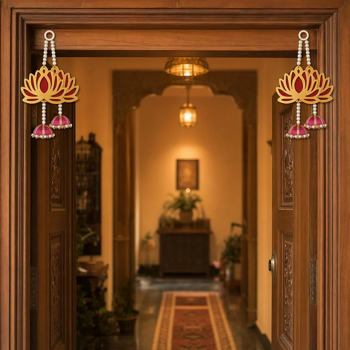 A doorway framed by red lotus latkans with pink jhumkas